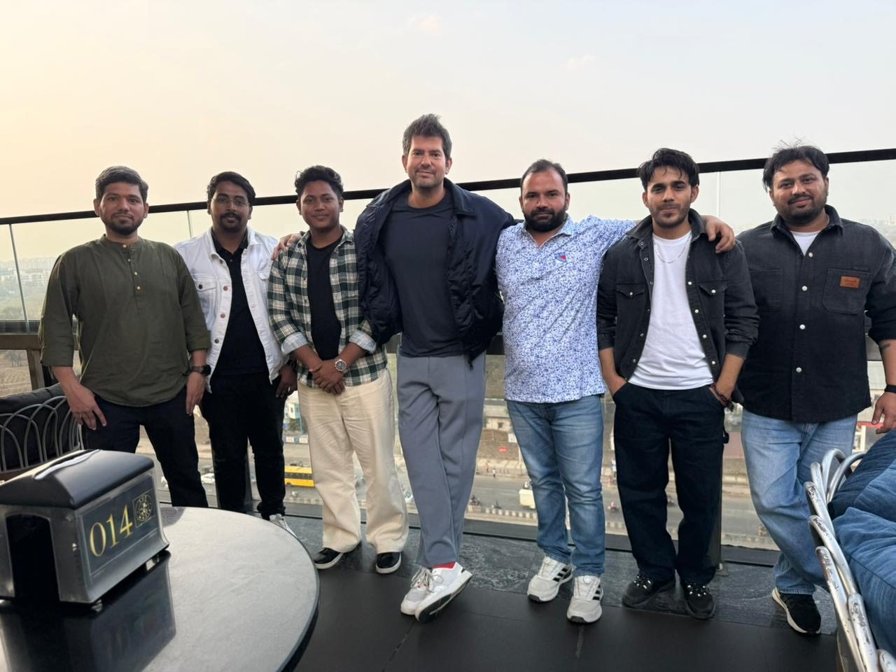 Manu with friends at a cafe